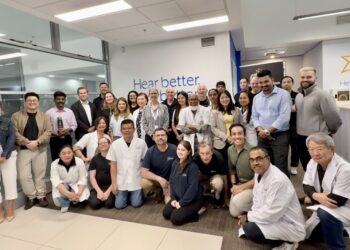 The Starkey Australia team with managing director Dawn Rollings (centre, striped shirt) who says the best leaders know how to inspire teams to deliver excellence while also fostering an environment of empathy and support. Image: Starkey.