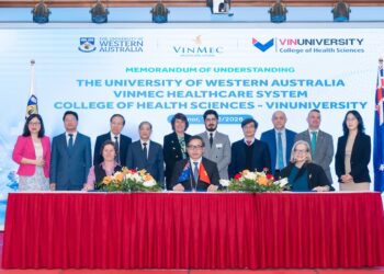 Dignitaries at the MOU signing in Vietnam including UWA audiologist Dr Robyn Choi (standing far right), Prof Silvana Gaudieri (seated far left), and Prof Charlene Kahlere (standing centre). Image: UWA.