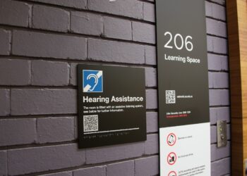Each lecture theatre has been fitted with a QR code which provides more information on how to access the technology. Image: The University of Queensland.