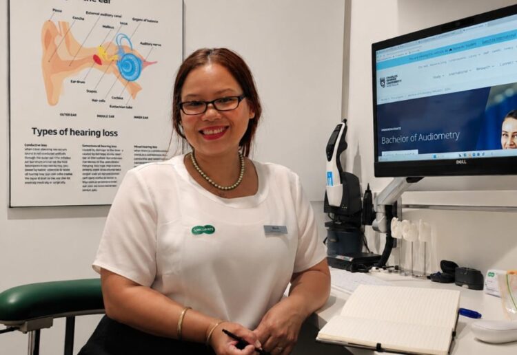 Brisbane audiometrist Nash October is studying her Bachelor of Audiometry online at Charles Darwin University. Image: Specsavers.