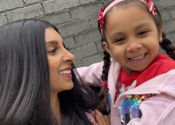 Melbourne audiologist Dr Verushka Selby-Hele and her daughter Santana wearing her bone conduction hearing aid on a softband. Image: Verushka Selby-Hele.